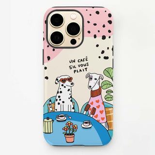Phone case with two dogs at a café table and 'Un café s'il vous plaît' text.