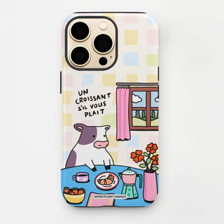 Phone case with a cow illustration and text on a white background