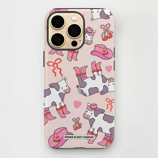 Phone case with cow pattern and pink accents on a light gray background