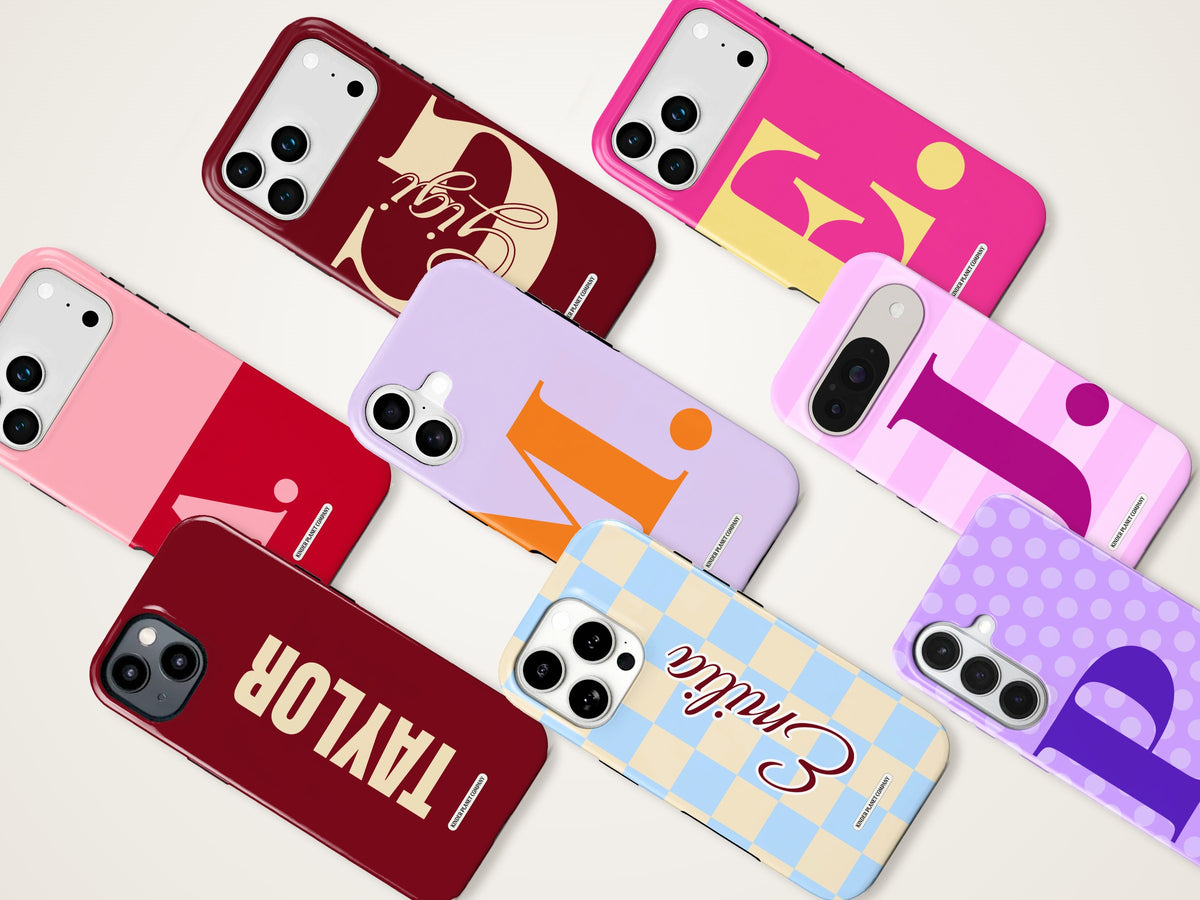 Personalised phone cases with initials, names and patterns laid out at an angle