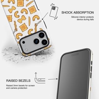 White phone case with a repeating pasta pattern, showing shock absorption and raised bezels.