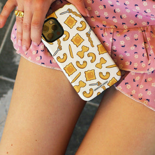 White phone case with repeating pasta shapes (ravioli, macaroni, bow ties) and "Pasta La Vista Baby" text.